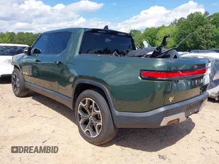 2023 Rivian R1T Adventure z VIN 7FCTGAAAXPN019894, wystawiony jako IAAI lot #42168226 z przebiegiem 23 380 mil mil oraz . Historia ofert i sprzedaży dostępna na DreamBid. Obrazek 3.