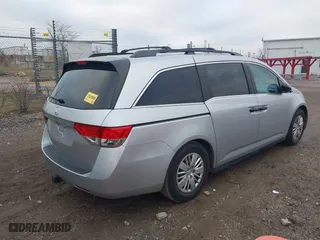2014 Honda Odyssey LX with VIN 5FNRL5H22EB026657, listed as a IAAI auction lot 41114634 with 132,125 mi miles. Bid and sale history available at carsss.com. Image 4.