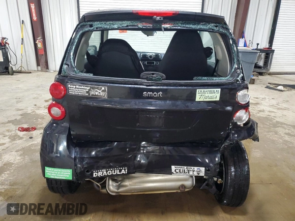 2015 Smart fortwo Passion с VIN WMEEJ3BA6FK820446, выставлен на аукционе Copart как лот 63243635 с пробегом Не указан миль и Списание • Salvage title. История ставок и продаж доступна на DreamBid. Изображение 6.