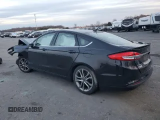 2017 Ford Fusion SE z VIN 3FA6P0HD1HR312200, wystawiony jako Copart lot #82823184 z przebiegiem Nie podano mil oraz Szkoda całkowita • Salvage title. Historia ofert i sprzedaży dostępna na DreamBid. Obrazek 2.
