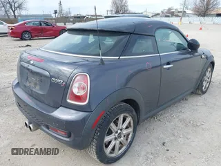 2013 MINI Coupe S with VIN WMWSX3C50DT466882, listed as a IAAI auction lot 42026938 with 99,499 mi miles and . Bid and sale history available at DreamBid. Image 4.