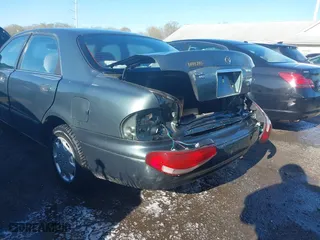 1998 Mazda 626 DX with VIN 1YVGF22C4W5768778, listed as a IAAI auction lot 41971066 with 119,168 mi miles. Bid and sale history available at carsss.com. Image 6.