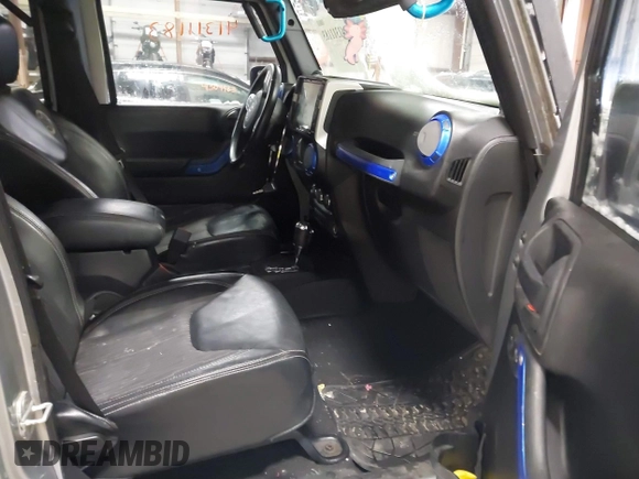 2013 Jeep Wrangler Unlimited Sport z VIN 1C4BJWDG3DL628784, wystawiony jako IAAI lot #41311183 z przebiegiem 125 118 mil mil oraz . Historia ofert i sprzedaży dostępna na DreamBid. Obrazek 5.