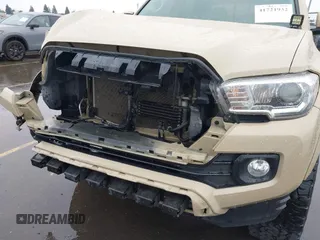 2016 Toyota Tacoma SR5 with VIN 3TMDZ5BN3GM003351, listed as a IAAI auction lot 41721932 with 100,774 mi miles and . Bid and sale history available at DreamBid. Image 18.