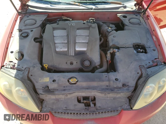 2003 Hyundai Tiburon GT z VIN KMHHN65F53U041351, wystawiony jako Copart lot #52332395 z przebiegiem 194 821 mil mil oraz Czysty tytuł • Clean title. Historia ofert i sprzedaży dostępna na DreamBid. Obrazek 11.