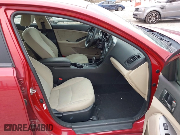 2015 Kia Optima LX with VIN 5XXGM4A72FG357449, listed as a IAAI auction lot 42079075 with 136,042 mi miles. Bid and sale history available at carsss.com. Image 5.