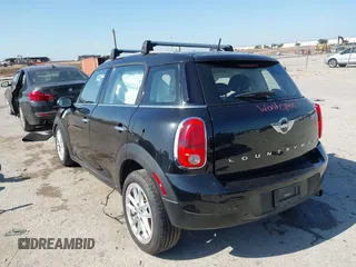 2015 MINI Countryman with VIN WMWZB3C54FWM33074, listed as a IAAI auction lot 42094992 with 86,704 mi miles and . Bid and sale history available at DreamBid. Image 3.