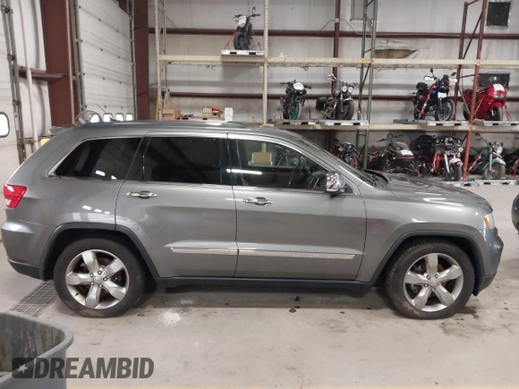 2013 Jeep Grand Cherokee Overland with VIN 1C4RJFCT9DC524605, listed as a IAAI auction lot 42016103 with 215,352 mi miles. Bid and sale history available at carsss.com. Image 13.