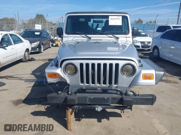 2004 Jeep Wrangler Rubicon with VIN 1J4FA69S94P701660, listed as a IAAI auction lot 41699554 with 74,640 mi miles. Bid and sale history available at carsss.com. Image 13.