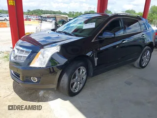 2012 Cadillac SRX Premium Collection z VIN 3GYFNCE36CS615725, wystawiony jako IAAI lot #42738584 z przebiegiem 156 625 mil mil oraz . Historia ofert i sprzedaży dostępna na DreamBid. Obrazek 17.