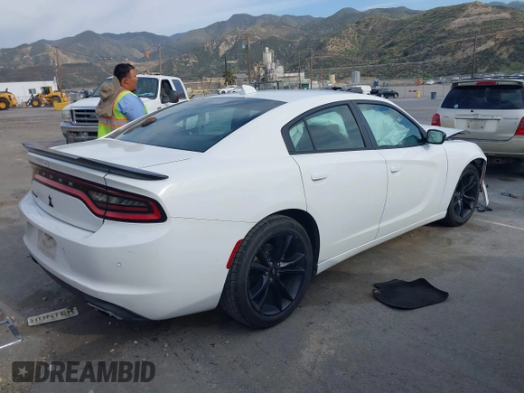 2018 Dodge Charger SXT Plus with VIN 2C3CDXHG4JH187580, listed as a IAAI auction lot 42024602 with 203,843 mi miles and . Bid and sale history available at carsss.com. Image 4.
