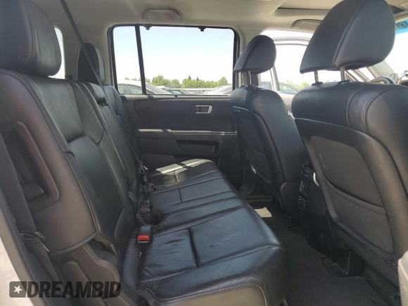2014 Honda Pilot Touring z VIN 5FNYF4H9XEB047993, wystawiony jako Copart lot #57518705 z przebiegiem 159 809 mil mil oraz Szkoda całkowita • Salvage title. Historia ofert i sprzedaży dostępna na DreamBid. Obrazek 11.