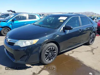 2014 Toyota Camry L with VIN 4T4BF1FK7ER438134, listed as a IAAI auction lot 41881798 with 137,886 mi miles. Bid and sale history available at carsss.com. Image 2.