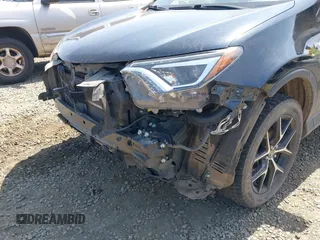 2018 Toyota RAV4 Hybrid SE with VIN JTMJJREV9JD191552, listed as a IAAI auction lot 42158665 with 84,025 mi miles and . Bid and sale history available at DreamBid. Image 17.