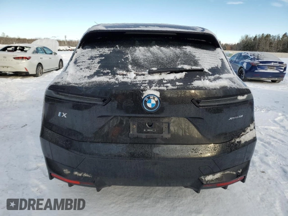 2025 BMW iX xDrive50 with VIN WB523CF04SCT20220, listed as a Copart auction lot 83225094 with 0 mi miles and Salvage Title. Bid and sale history available at carsss.com. Image 6.