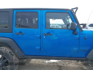 2015 Jeep Wrangler Unlimited Rubicon with VIN 1C4BJWFG5FL558348, listed as a IAAI auction lot 41460025 with 106,012 mi miles. Bid and sale history available at carsss.com. Image 13.