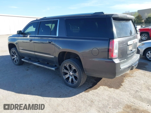 2015 GMC Yukon XL Denali with VIN 1GKS2JKJ9FR634771, listed as a IAAI auction lot 41676218 with 73,271 mi miles. Bid and sale history available at carsss.com. Image 3.