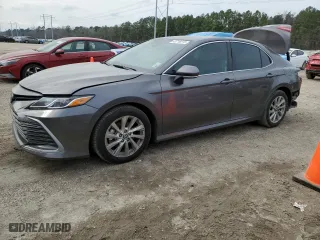 2024 Toyota Camry LE with VIN 4T1R11AK7RU857802, listed as a Copart auction lot 43718215 with 71,375 mi miles and Salvage Title. Bid and sale history available at carsss.com. Image 1.