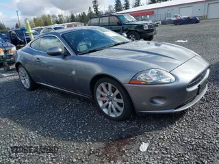 2007 Jaguar XK with VIN SAJWA43B675B17854, listed as a IAAI auction lot 42003478 with 64,149 mi miles. Bid and sale history available at carsss.com. Image 1.