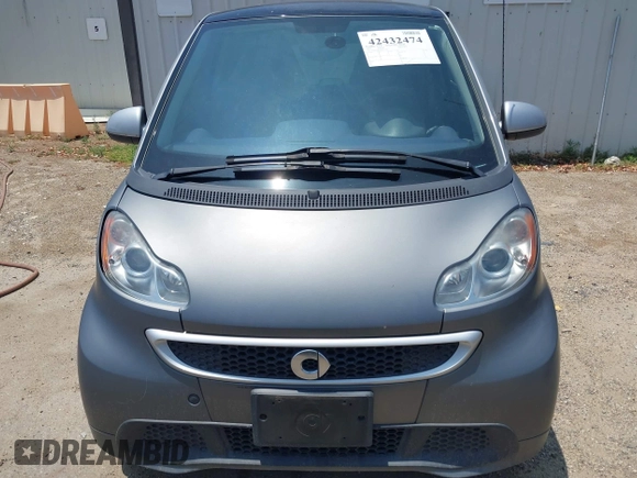 2013 Smart fortwo Pure z VIN WMEEJ3BA4DK611770, wystawiony jako IAAI lot #42432474 z przebiegiem 75 239 mil mil oraz . Historia ofert i sprzedaży dostępna na DreamBid. Obrazek 6.