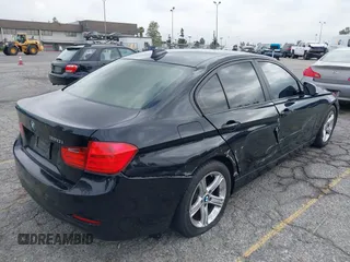 2014 BMW 3 Series 320i with VIN WBA3B1G57ENS80800, listed as a IAAI auction lot 42097683 with 152,924 mi miles. Bid and sale history available at carsss.com. Image 4.