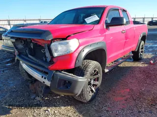 2016 Toyota Tundra 4WD Truck SR with VIN 5TFUM5F16GX064645, listed as a IAAI auction lot 41614790 with 144,400 mi miles. Bid and sale history available at carsss.com. Image 2.