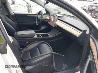 2023 Tesla Model Y Performance with VIN 7SAYGDEF7PF807312, listed as a IAAI auction lot 41711068 with 25,029 mi miles and . Bid and sale history available at DreamBid. Image 5.