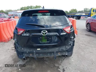 2016 Mazda CX-5 Touring with VIN JM3KE2CY5G0653108, listed as a IAAI auction lot 37717249 with 90,704 mi miles and . Bid and sale history available at DreamBid. Image 17.
