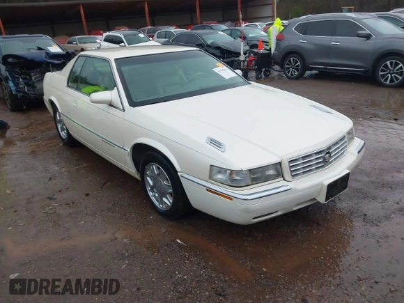 1997 Cadillac Eldorado ESC z VIN 1G6EL12Y6VU614754, wystawiony jako IAAI lot #41543611 z przebiegiem 73 273 mil mil oraz . Historia ofert i sprzedaży dostępna na DreamBid. Obrazek 1.