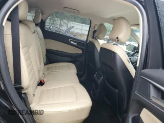 2019 Ford Edge SEL z VIN 2FMPK4J9XKBB10418, wystawiony jako Copart lot #58368335 z przebiegiem 97 458 mil mil oraz Czysty tytuł • Clean title. Historia ofert i sprzedaży dostępna na DreamBid. Obrazek 11.