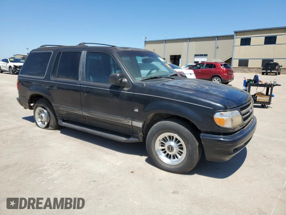 1997 Ford Explorer XLT with VIN 1FMDU35P5VZB51640, listed as a Copart auction lot 52030474 with 214,647 mi miles and Clean title. Bid and sale history available at DreamBid. Image 4.