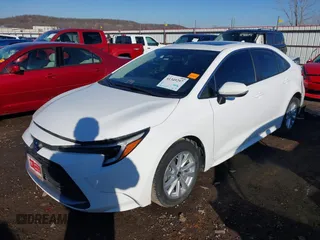 2023 Toyota Corolla Hybrid LE with VIN JTDBCMFE1PJ011085, listed as a IAAI auction lot 41340297 with 34,437 mi miles. Bid and sale history available at carsss.com. Image 2.