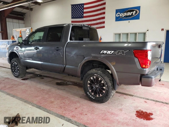 2016 Nissan Titan XD PRO-4X with VIN 1N6BA1F46GN501801, listed as a Copart auction lot 63231474 with 127,728 mi miles and Clean Title. Bid and sale history available at carsss.com. Image 2.