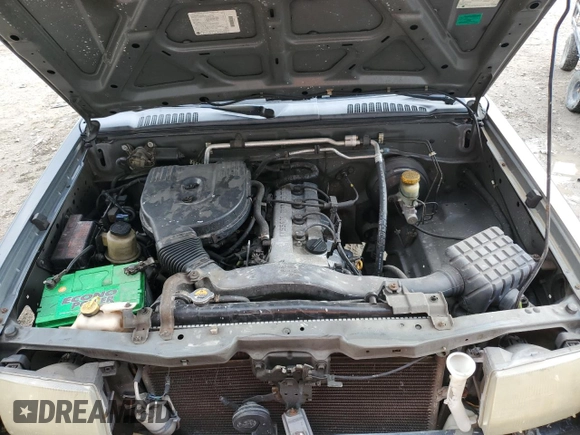 2000 Nissan Frontier XE z VIN 1N6DD21S8YC430562, wystawiony jako Copart lot #86827384 z przebiegiem Nie podano mil oraz Szkoda całkowita • Salvage title. Historia ofert i sprzedaży dostępna na DreamBid. Obrazek 11.