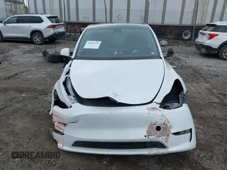 2022 Tesla Model Y Long Range with VIN 7SAYGAEE4NF516625, listed as a IAAI auction lot 41892225 with 33,054 mi miles and . Bid and sale history available at DreamBid. Image 12.