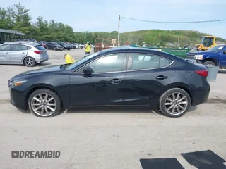 2017 Mazda 3 Touring z VIN 3MZBN1V74HM133565, wystawiony jako IAAI lot #42160836 z przebiegiem 104 997 mil mil oraz . Historia ofert i sprzedaży dostępna na DreamBid. Obrazek 14.