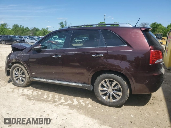 2012 Kia Sorento SX z VIN 5XYKWDA29CG301363, wystawiony jako Copart lot #55954815 z przebiegiem 83 206 mil mil oraz Szkoda całkowita • Salvage title. Historia ofert i sprzedaży dostępna na DreamBid. Obrazek 2.