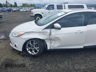 2014 Ford Focus Titanium with VIN 1FADP3J27EL142095, listed as a IAAI auction lot 42004419 with 139,515 mi miles. Bid and sale history available at carsss.com. Image 6.