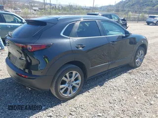 2023 Mazda CX-30 S Carbon Edition with VIN 3MVDMBCM1PM509987, listed as a IAAI auction lot 42060833 with 14,140 mi miles and . Bid and sale history available at DreamBid. Image 4.