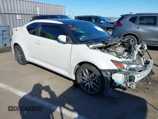 2016 Scion tC z VIN JTKJF5C77GJ024642, wystawiony jako IAAI lot #41696001 z przebiegiem 92 180 mil mil oraz . Historia ofert i sprzedaży dostępna na DreamBid. Obrazek 1.