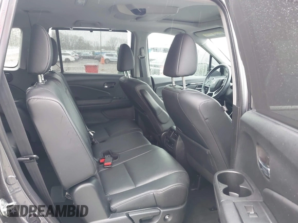2021 Honda Pilot Touring 8-Passenger with VIN 5FNYF5H9XMB014190, listed as a IAAI auction lot 41749586 with 67,602 mi miles and . Bid and sale history available at DreamBid. Image 8.
