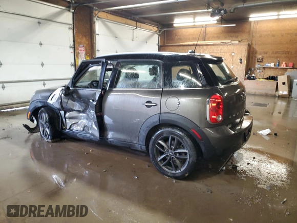 2014 MINI Countryman with VIN WMWZB3C59EWR42124, listed as a Copart auction lot 57830395 with 125,000 mi miles and Salvage title. Bid and sale history available at DreamBid. Image 2.
