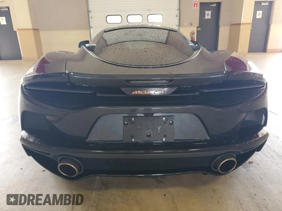 2023 McLaren GT z VIN SBM22GCAXPW002692, wystawiony jako Copart lot #41496504 z przebiegiem Nie podano mil oraz . Historia ofert i sprzedaży dostępna na DreamBid. Obrazek 6.