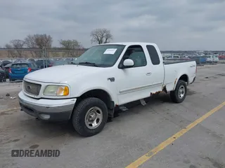 2003 Ford F-150 XL with VIN 1FTRX18L73NB72735, listed as a IAAI auction lot 42016567 with 0 mi miles. Bid and sale history available at carsss.com. Image 2.