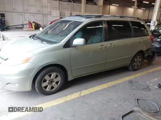 2007 Toyota Sienna XLE with VIN 5TDZK22C37S023719, listed as a IAAI auction lot 41566286 with 239,296 mi miles. Bid and sale history available at carsss.com. Image 2.