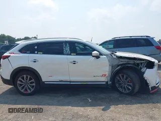 2020 Mazda CX-9 Grand Touring with VIN JM3TCBDY3L0410674, listed as a IAAI auction lot 42389157 with 130,519 mi miles and . Bid and sale history available at DreamBid. Image 13.