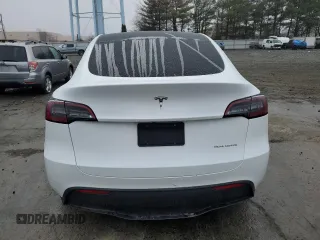 2023 Tesla Model Y Long Range z VIN 7SAYGDEE7PA102174, wystawiony jako Copart lot #49904435 z przebiegiem 144 702 mil mil oraz Szkoda całkowita • Salvage title. Historia ofert i sprzedaży dostępna na DreamBid. Obrazek 6.