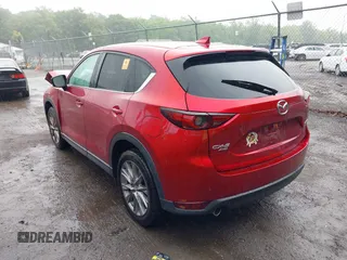 2019 Mazda CX-5 Grand Touring with VIN JM3KFBDM8K0693622, listed as a IAAI auction lot 42503818 with 60,812 mi miles and . Bid and sale history available at DreamBid. Image 3.