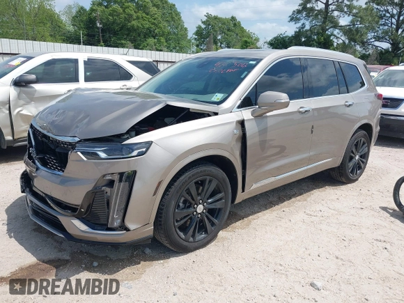 2022 Cadillac XT6 Premium Luxury z VIN 1GYKPCRS4NZ107852, wystawiony jako IAAI lot #42075012 z przebiegiem 66 046 mil mil oraz . Historia ofert i sprzedaży dostępna na DreamBid. Obrazek 17.