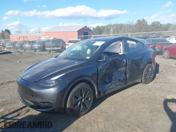 2024 Tesla Model Y Long Range with VIN 7SAYGAEEXRF212415, listed as a IAAI auction lot 41665627 with Not Provided miles and . Bid and sale history available at DreamBid. Image 2.